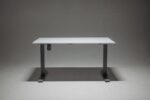 Sleek adjustable height standing desk with a single motor for ergonomic office solutions.